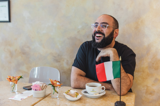 Alfred Drinking Coffee smiling