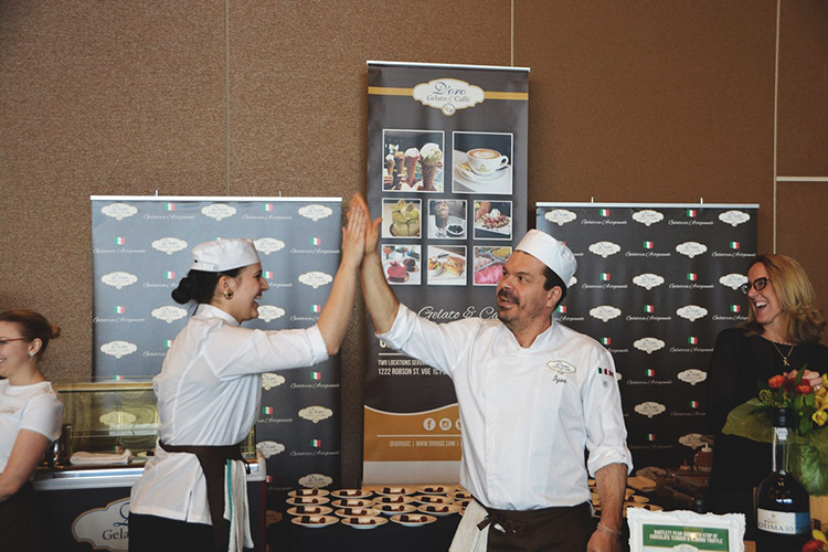 chefs high fiving at gelato booth