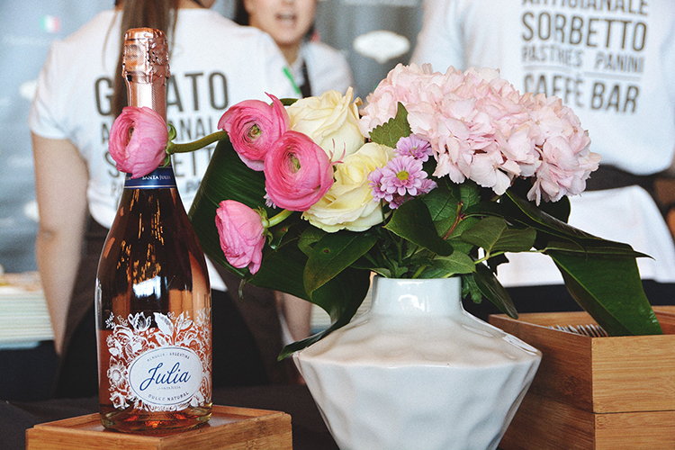julia wine bottle next to flowers