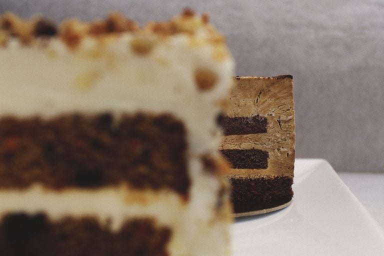 cakes topped with frosting and nuts